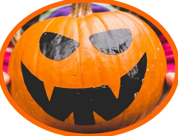 simple pumpkin face made from adhesive cut-outs