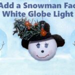 white globe light bulb painted with adorable snowman face