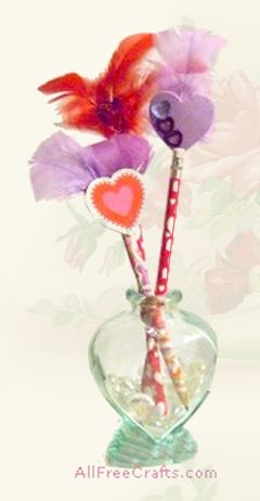 homemade valentine pencils with feathers and hearts