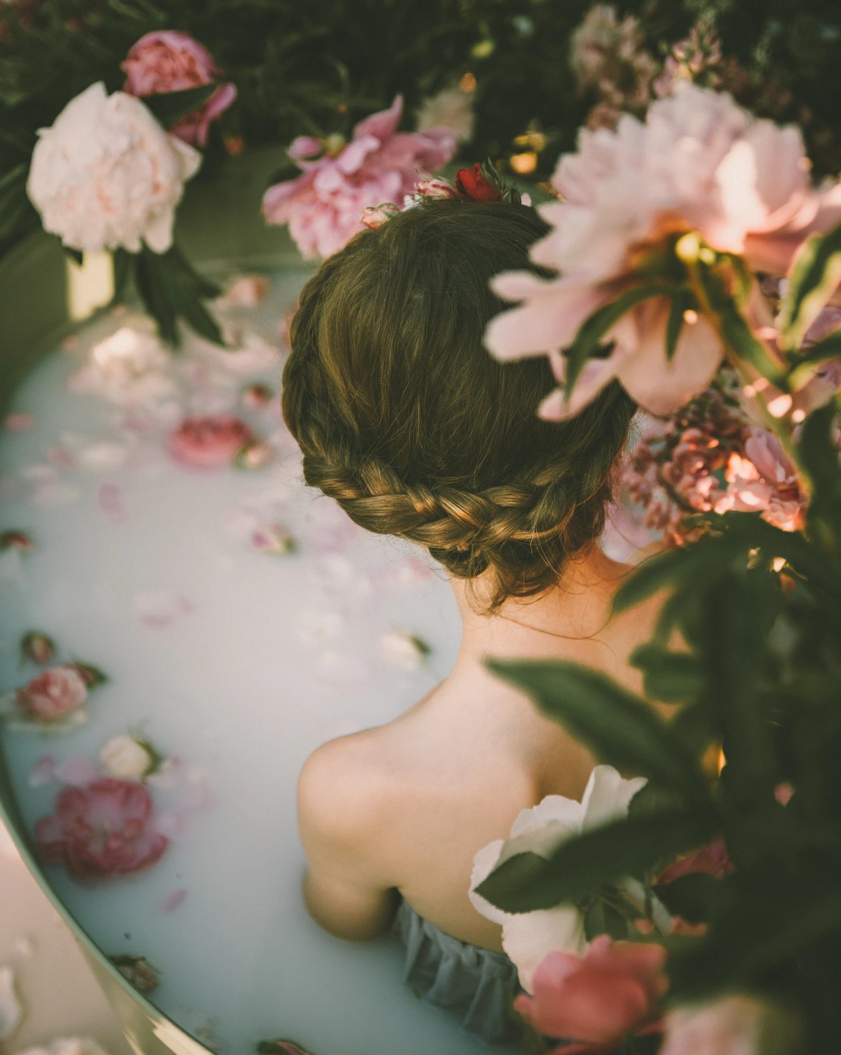 woman bathing in milk and roses