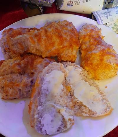 baked scones with cheese topping and butter