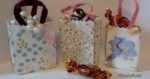 three completed tiny paper gift bags